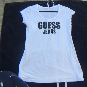 A white , guess jeans shirt. Never been worn.